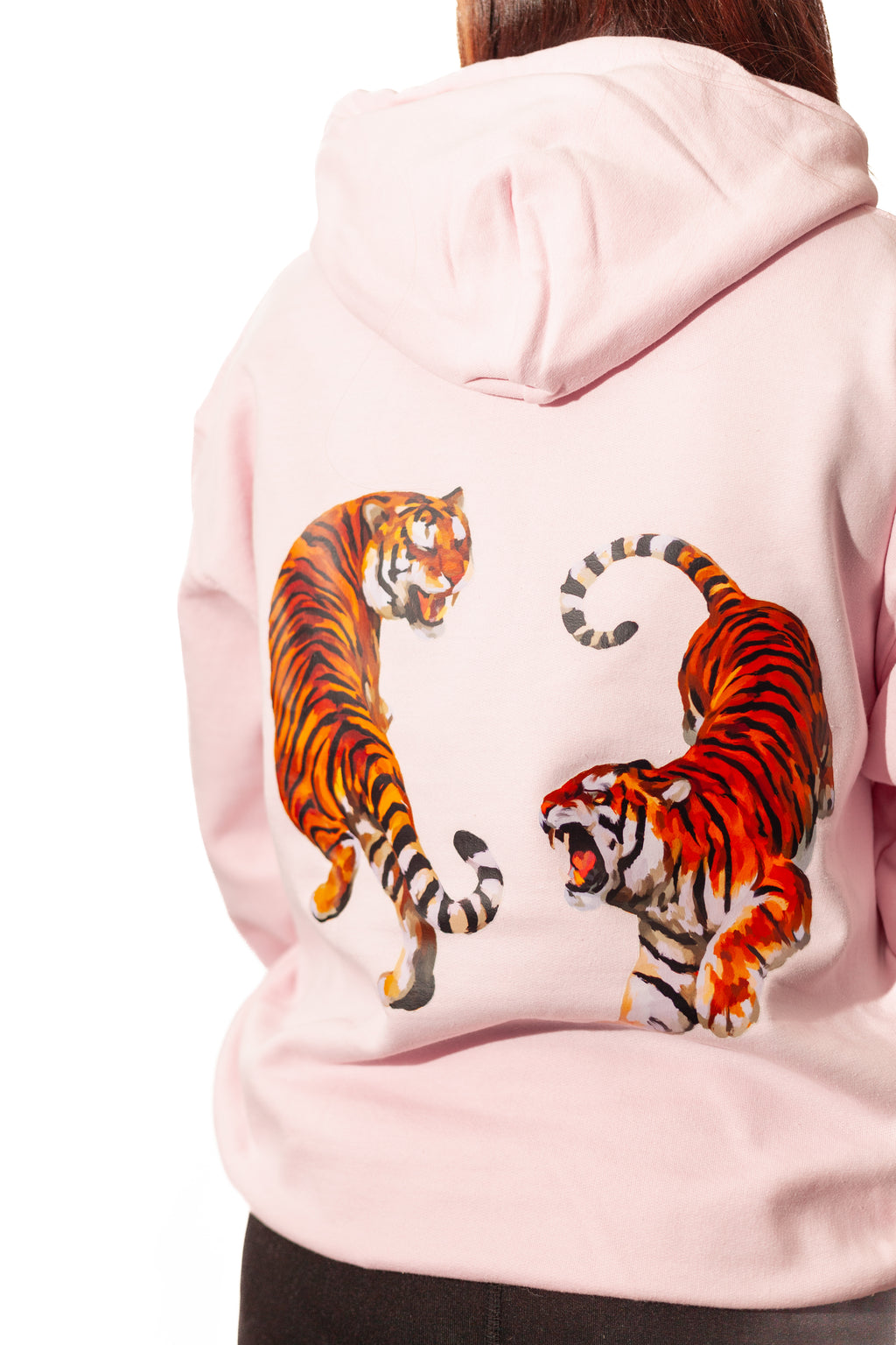 Pink hoodie with tiger designs on the back