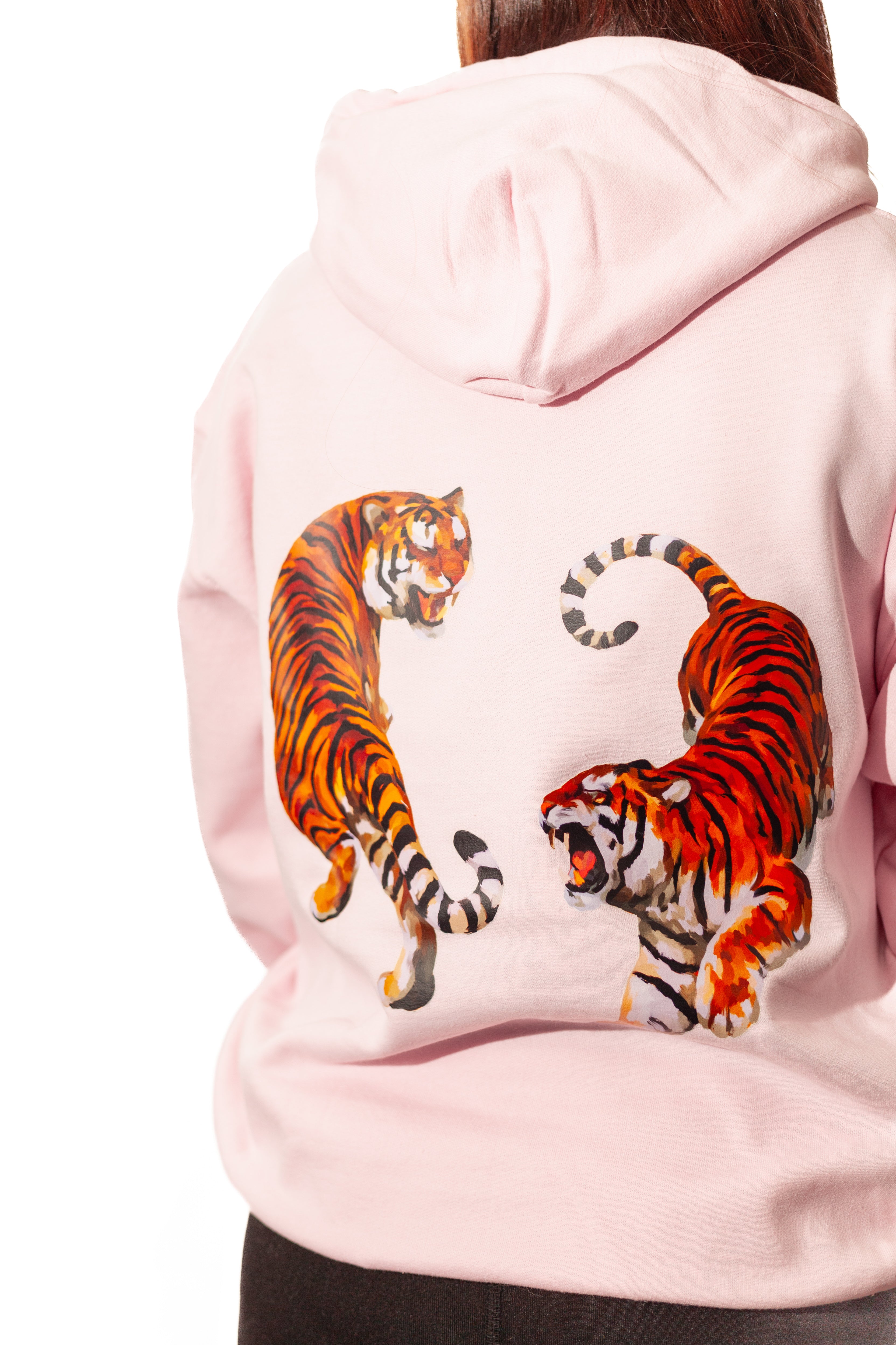 Pink hoodie with tiger designs on the back